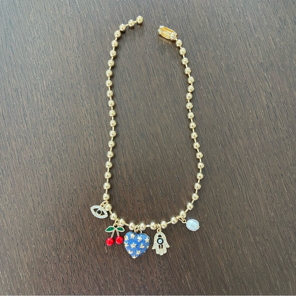 Gold Charm Necklace with Blue and Red Accents